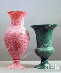 white glass vases with coloured dots to