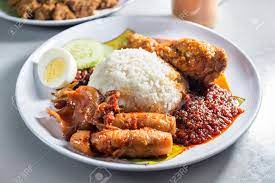 Nasi lemak is practically the symbol of malaysia; Delicious Nasi Lemak With Chicken And Sotong Asian Food Stock Photo Picture And Royalty Free Image Image 116416801