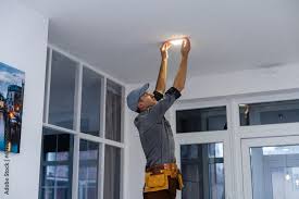 An Electrician Is Installing Spotlights