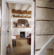 open door in cream painted brick hall