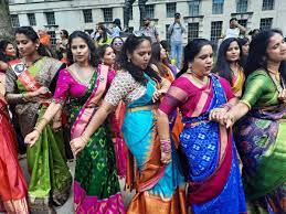 700 saree clad pio women dance