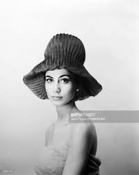 Model Presenting A Hat Designed By French Fashion Designer