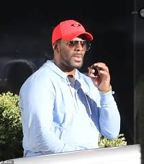 R Kelly Smokes Cigar Outside Of His Chicago Apartment Amid