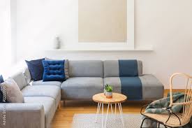 navy blue cushions on a gray couch a