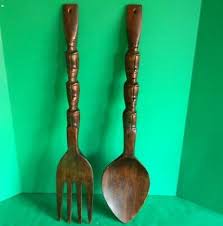 large wooden fork and spoon wall decor