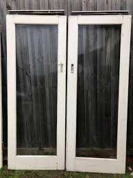 Timber Doors With Glass Panels In