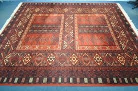 worsted wool red ground rug 366cm x