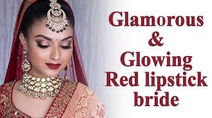 glamrous makeup for a red lehenga bride