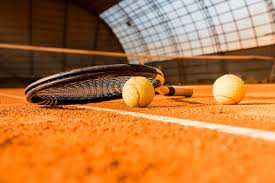 premium photo tennis racket on ball