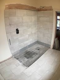 tiling a wet room tray with large tiles