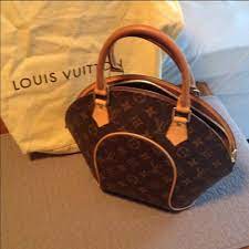 Learn how we diligently authenticate, buy and sell only original louis vuitton the classic monogram on a louis vuitton bag are interlocking letters lv, where v is slightly above l. Louis Vuitton Bags Louis Vuitton Round Purse Poshmark