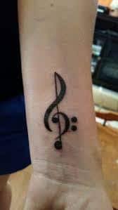 Blue ink music heart tattoo. What Does Treble Clef Tattoo Mean Represent Symbolism