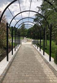 a metal garden pergola rose tunnel