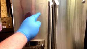 cleaning tape stain off a ge fridge