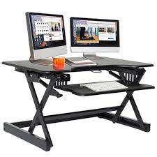 What are the shipping options for corner desks? Ergonomic Height Adjustable Sit To Stand Desk Computer Riser Black Target