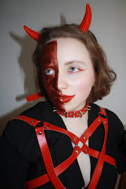 woman in devil costume and makeup for