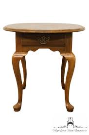 This unique oval top design features a functional drawer with an attractive bail pull. Kling Furniture Solid Cherry Queen Anne Oval Accent End Table 18 0483 High End Used Furniture