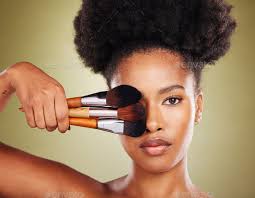 black woman makeup brush and beauty in