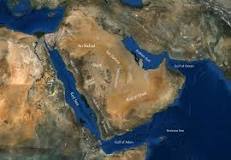 What geographic features run along the western edge of Arabian Peninsula?