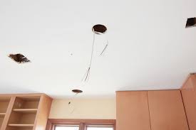 Then grab the part where the bulb screws in and squeeze the two metal brackets on the side to remove it from the metal can: Tips For Installing Retrofit Recessed Lighting