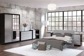 Instead of matching your bed to your bedside tables, try using a bedspread or a comforter to bring the room together. Lynx Black And Grey Wooden Bedroom Furniture Collections