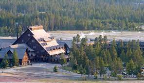 The old faithful inn's chalet features applied to its log skeleton typify the rustic style. Old Faithful Inn And Cabins In Yellowstone National Park