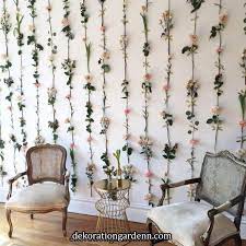 a flower wall with fake flowers with