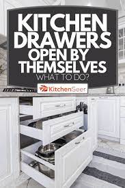 kitchen drawers open by themselves
