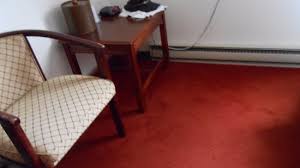 ugly red rug and old furniture