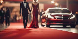 red carpet with luxury cars