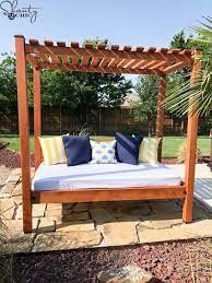 This diy outdoor sectional sofa is built from plywood and features storage for the cushions. Diy Outdoor Day Bed For About 200 Shanty 2 Chic