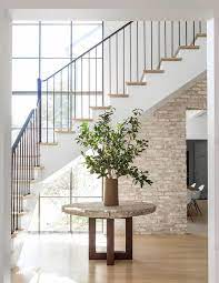 When you use coasters, be sure that they match the shape of the dining table. Round Table Under Staircase Design Ideas