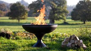 Lighting a fire pit that uses gas/propane. Fire Pit Ideas 19 Ways To Cosy Up After Dark And Create An Enchanting Atmosphere Gardeningetc