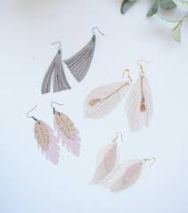 These earrings were perfect with her top. Diy Feather Earrings