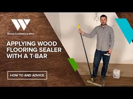 applying wood flooring sealer with a t