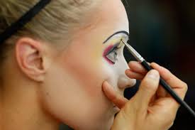 christina jones prepares her makeup