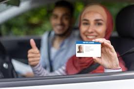 female in hijab show driving license
