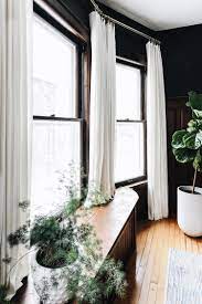 hanging curtains in a bay window
