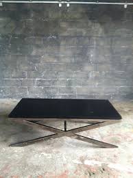 chrome cross legged coffee table with