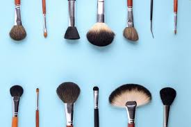 makeup brushes on a blue background