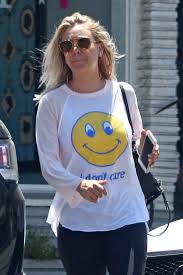 kaley cuoco in a smiley tee and yoga