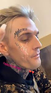 Aaron carter's tattoo artist is filling in the blanks about how the star's face became covered in ink. Aaron Carter Debuts Face Tattoo Dedicated To Girlfriend Melanie Martin People Com