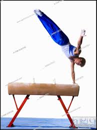 male gymnast performing routines on