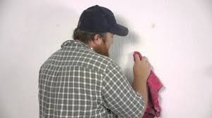 how to remove wall adhesive from