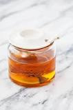 Does hot water Decrystallize honey?