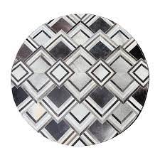 grey triangle design round cowhide rug