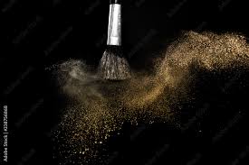 gold powder splash and brush for makeup