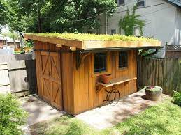 A Cky Garden Shed With A Planted Roof