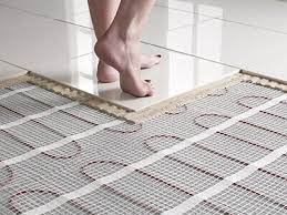 This in floor heating system consists of one thin continuous cable heating element woven into a mat that you install under the tile. Radiant Floor Heating Cost Hydronic Vs Electric Radiant Flooring Remodeling Cost Calculator