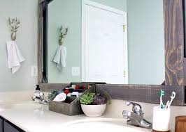 A bathroom mirror is a functional item that can be found in almost any bathroom. How To Frame A Mirror With Wood Tag Tibby Design